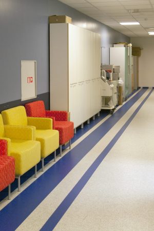 Corridor and waiting areas of a modern hospital with seating