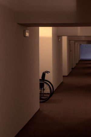 Wheelchair in hospital corridor, diminishing perspective image with no people